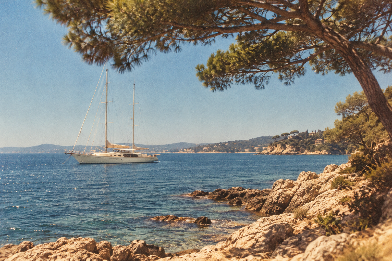 AI-generated Riviera scene with a sailing yacht, pine trees and sunlit rocks